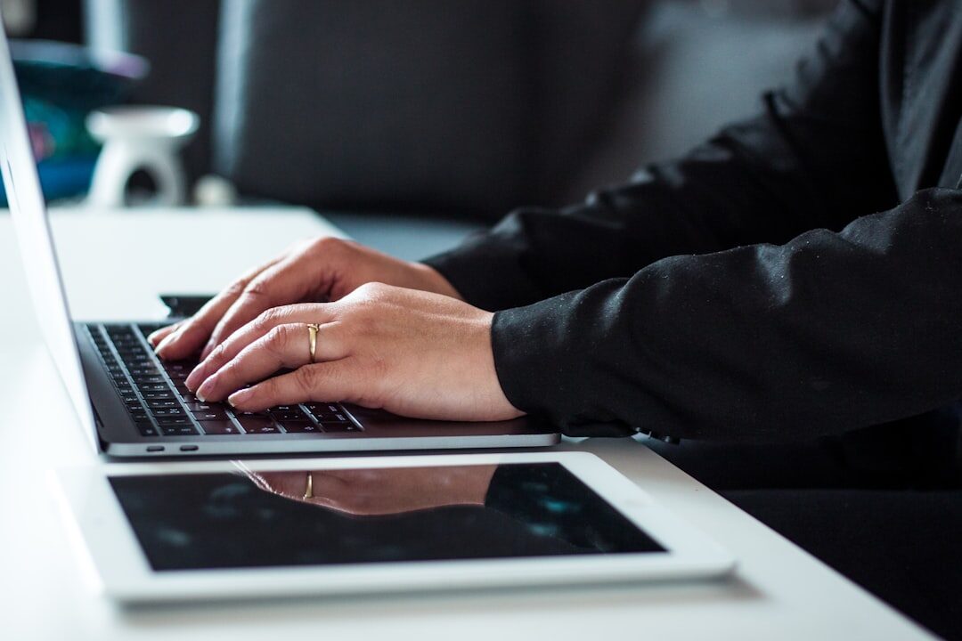 writer typing on laptop