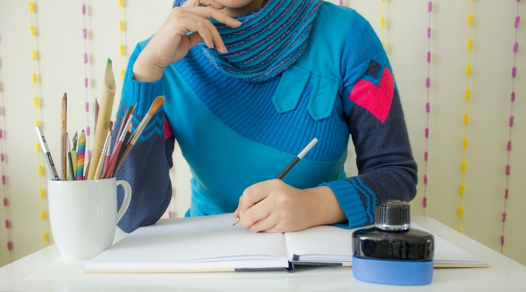 writer at desk with notebook