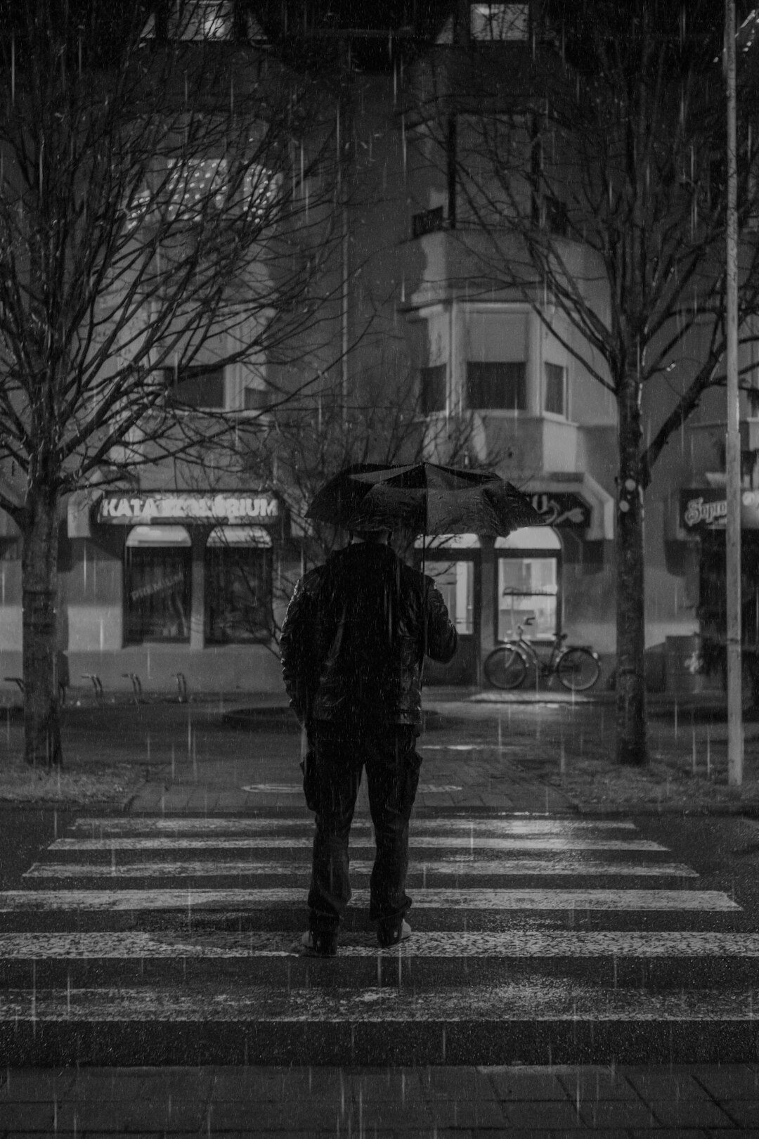 dark detective in rain
