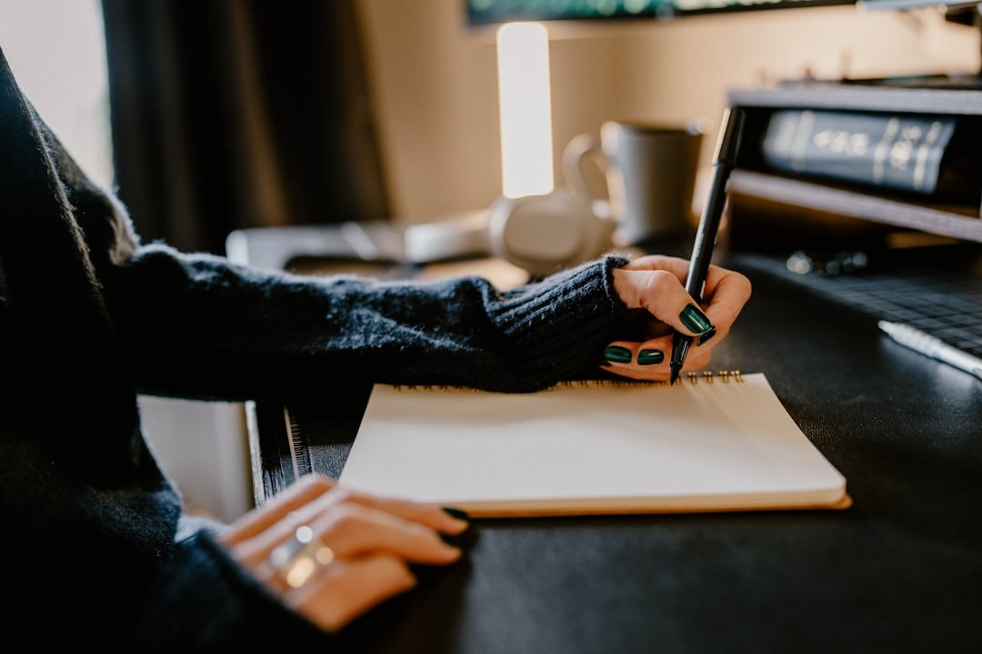 writer at desk with notebook
